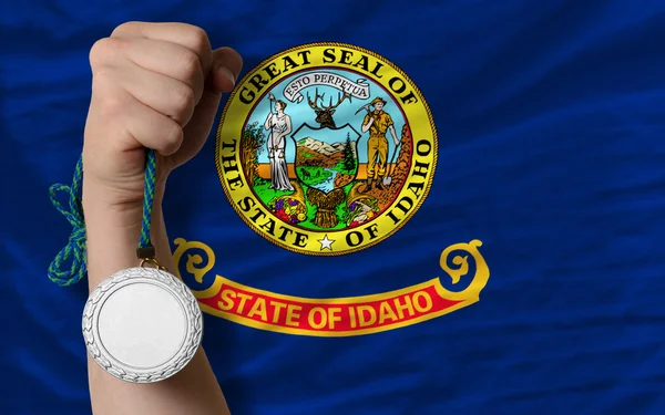 Medalha de prata por esporte e bandeira do estado americano de idaho — Fotografia de Stock