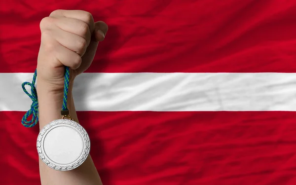Silver medal for sport and national flag of latvia — Stock Photo, Image