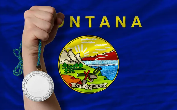 Silver medal for sport and flag of american state of montana — Stock Photo, Image