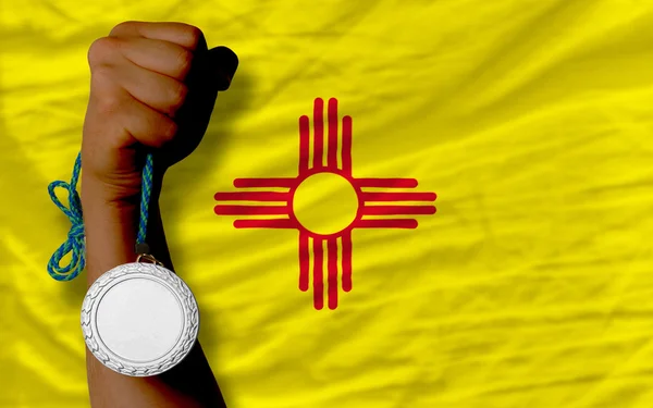 Silver medal for sport and flag of american state of new mexico — Stock Photo, Image