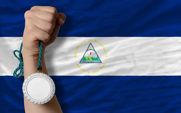 Medalla de plata por deporte y bandera nacional de nicaragua — Foto de Stock