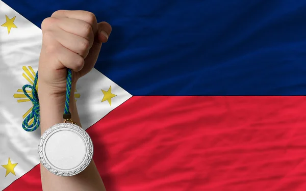 Medalha de prata por desporto e bandeira nacional de filipinas — Fotografia de Stock