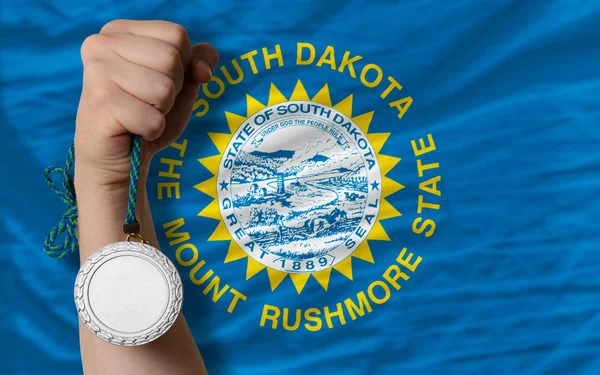 Silvermedalj för idrott samt nationella flagga i south dakota — Stockfoto