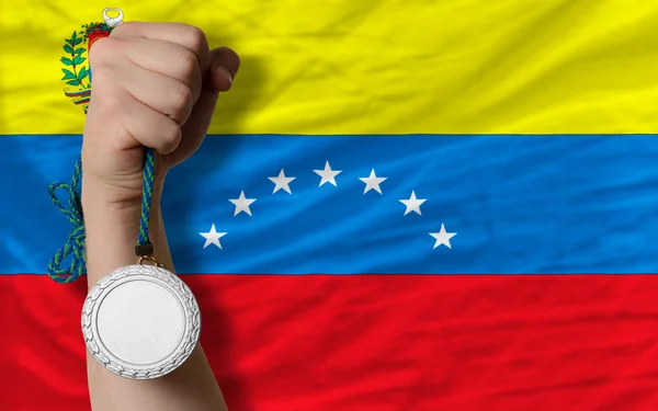 Silver medal for sport and national flag of venezuela — Stock Photo, Image