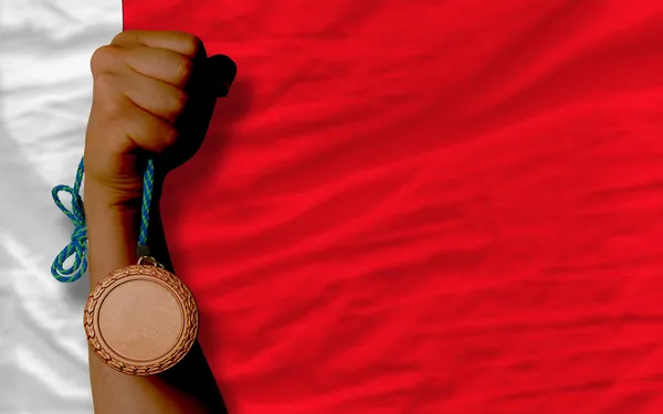 Medalha de bronze por esporte e bandeira nacional do Bahrein — Fotografia de Stock