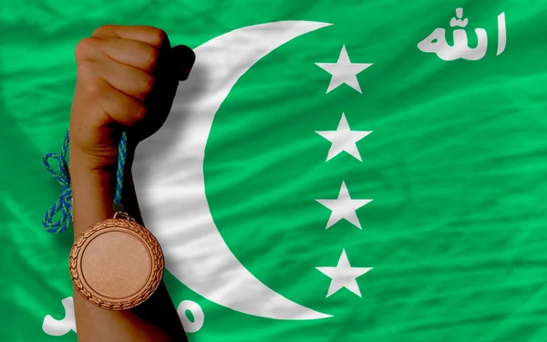 Bronze medal for sport and national flag of of comoros — Stock Photo, Image