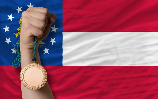 Medaglia di bronzo per lo sport e bandiera dello stato americano della georgia — Foto Stock