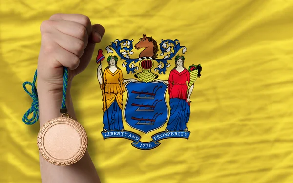 铜牌为体育和旗子的美国新泽西州 — 图库照片