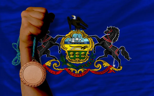 Bronze medal for sport and flag of american state of pennsylvan — Stock Photo, Image