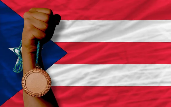 Bronz érem a sport és a puertorico nemzeti zászlaja — Stock Fotó
