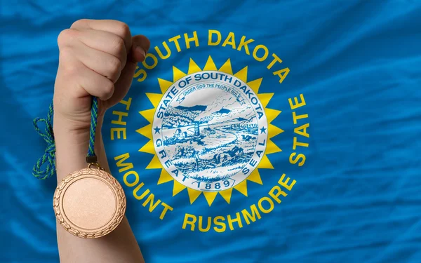 Bronze medal for sport and national flag of south dakota — Stock Photo, Image