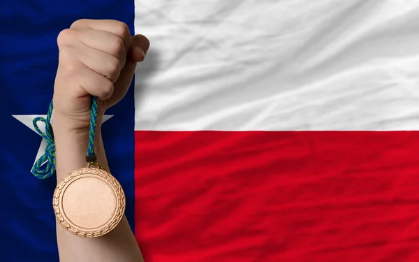 Bronze medal for sport and flag of american state of texas — Stock Photo, Image