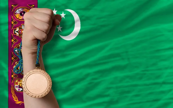 Medaglia di bronzo per lo sport e bandiera nazionale del turkmenistan — Foto Stock