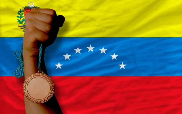 Bronzová medaile pro sport a státní vlajka Venezuely — Stock fotografie