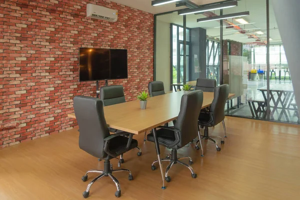 Modern community lounge service with TV monitor. Meeting room or co-working space area. Interior design decoration.