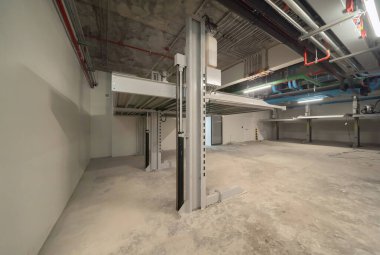 Automatic row of cars of lift or elevator parking system, mechanical vehicle  innovative material and building platforms in transportation service concept. Underconstruction site.