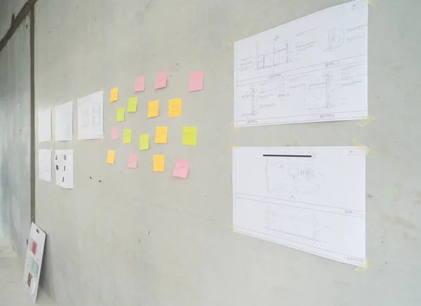 Paperwork and structure drawing plan in a room. New project architecture building in construction site.