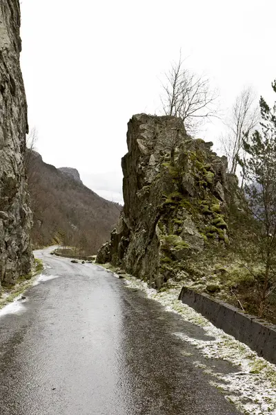 Run-down road in rural landscape — Stock Photo, Image