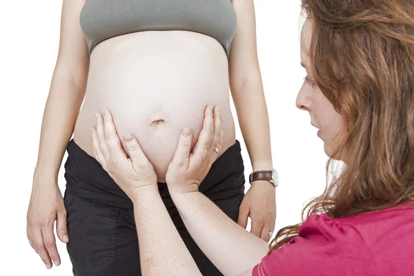 Midwife fingering at human belly — Stock Photo, Image