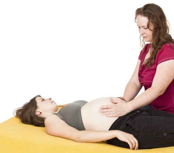 Midwife sitting behind pregnant woman — Stock Photo, Image