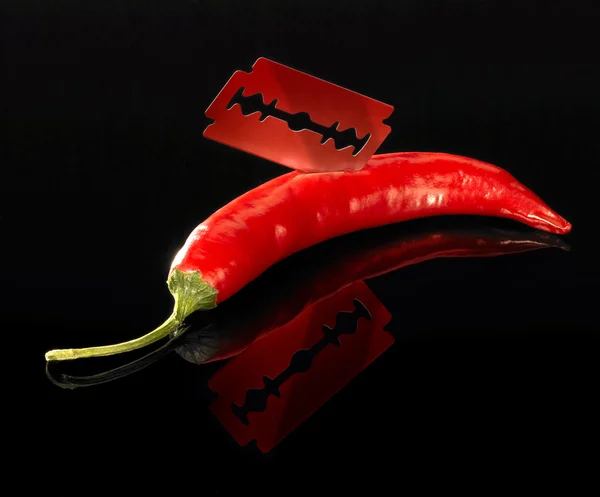 Chili and razor blade — Stock Photo, Image