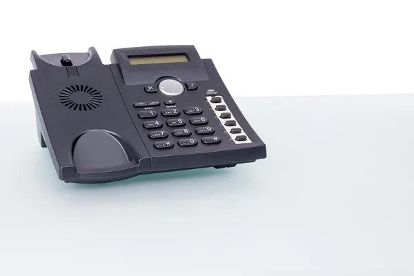 Teléfono VoIP en escritorio de cristal — Foto de Stock