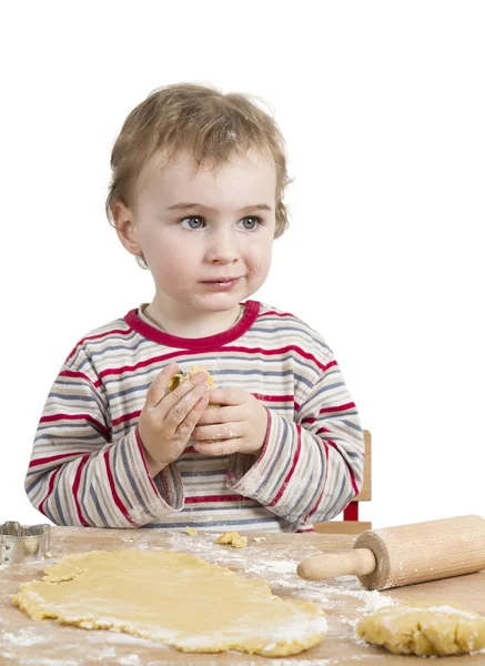 Glückliches kleines Kind mit Nudelholz auf weißem Hintergrund — Stockfoto