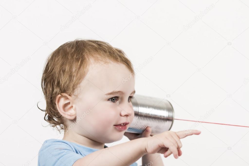 child with tin can phone