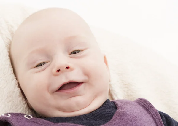 Newborn child laughing to camera — Stock Photo, Image