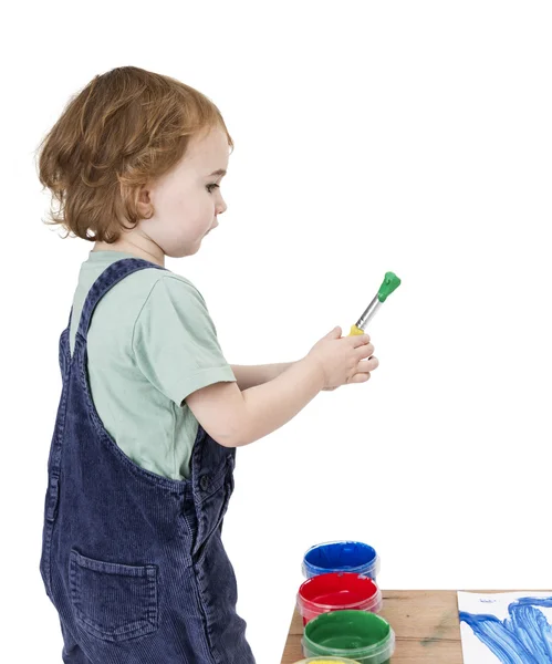 Child with brush and green paint — Stock Photo, Image