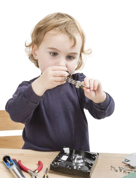 Little girl repairing computer parts — Stock Photo, Image
