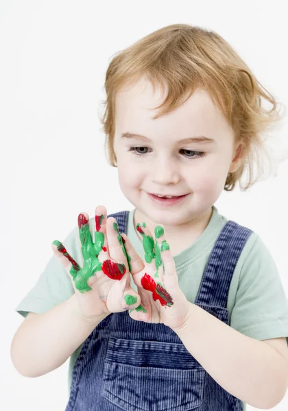 Cute little girl with finger paint — Stock Photo, Image