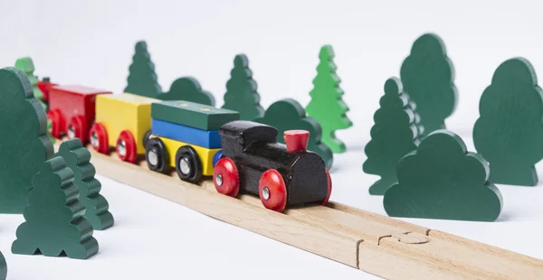 Wooden toy train in rural landscape — Stock Photo, Image