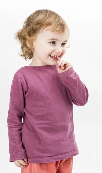 Abashed young girl in light grey background — Stock Photo, Image