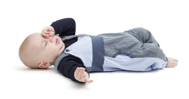 tired baby on floor isolated on white clipart
