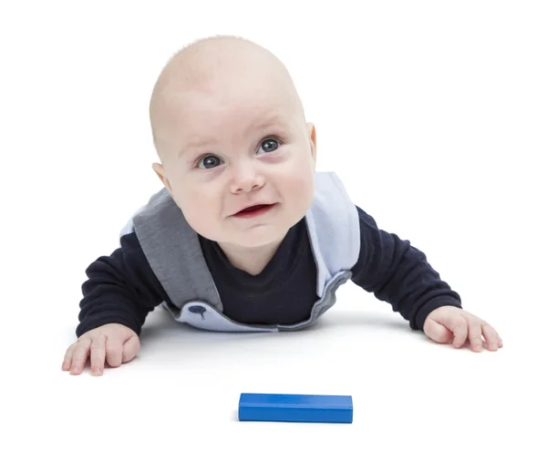 Interested baby with toy block — Stock Photo, Image