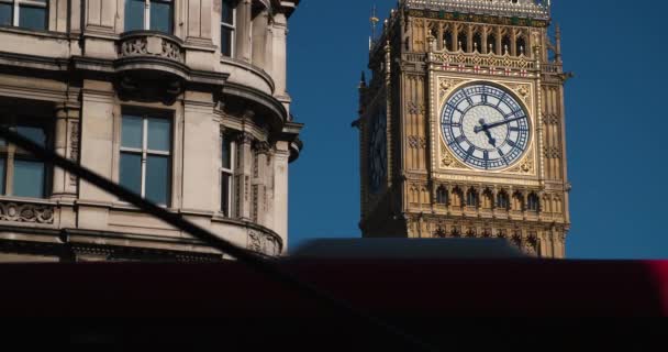 Red London Buses Crossing Front Big Ben Houses Parliament Blue — Stockvideo