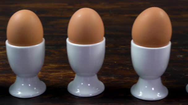 Dolly Shot Row Boiled Eggs White Egg Cups One Egg — Vídeo de stock