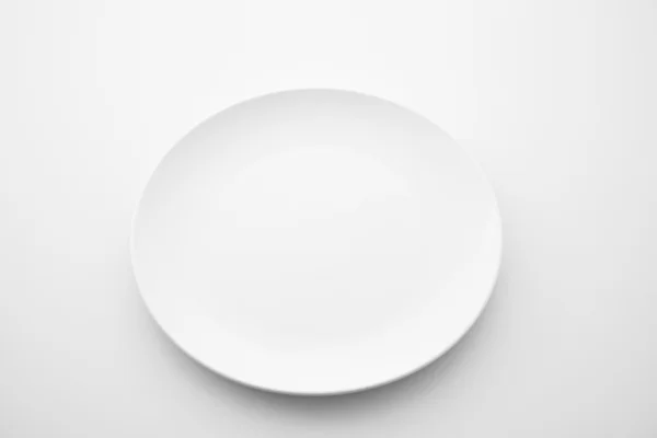 Porcelain plate on white background — Stock Photo, Image