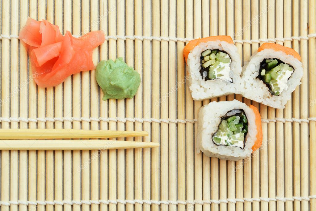 3 Pieces Of Sushi Roll On Bamboo Mat Stock Photo C Atomadog