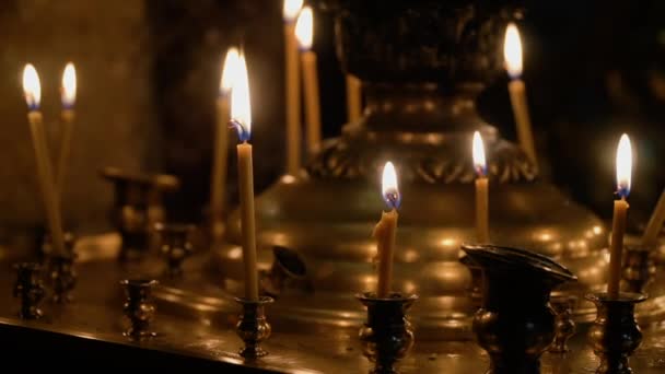 Burning candles in the Christian Orthodox Church. The theme of religion, faith and the Orthodox Church — Wideo stockowe