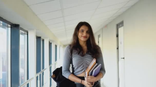 Indian woman student walking down the corridor of the university. Education concept — стокове відео