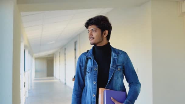 Indian student with a books in the university. New modern fully functional education facility. Education abroad — Video Stock