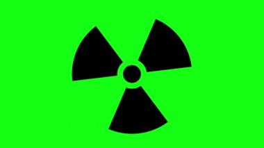 Yeşil arkaplanda dönen siyah radyasyon sembolü animasyonu