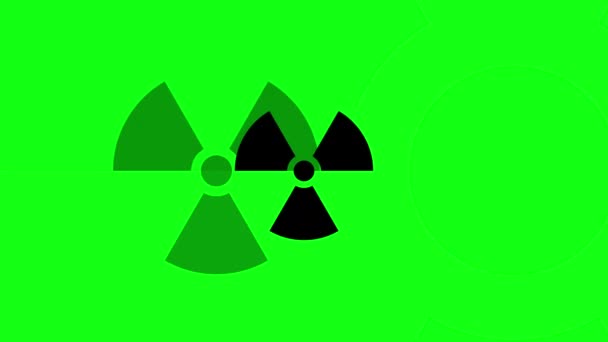 Animation eines schwarzen Strahlungszeichen-Symbols auf grünem Hintergrund, das von der Bildmitte zum Betrachter pulsiert — Stockvideo