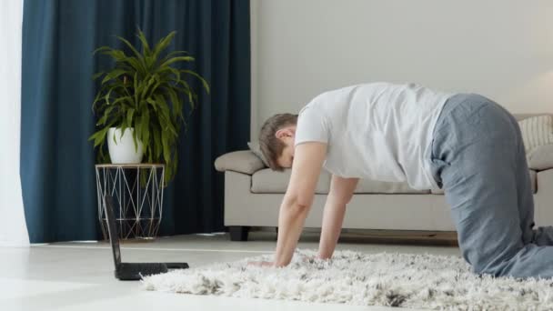 Senior woman doing meditation exercise stretching sports yoga. Bright Room at Home — ストック動画