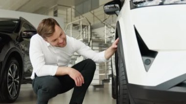 A man examine vehicle before making purchase. Buy car