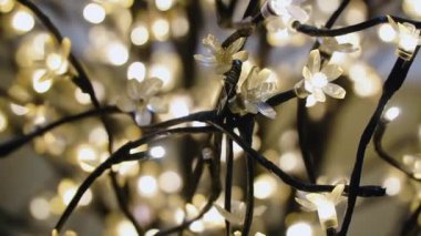 Golden garland of warm white lights in a blur
