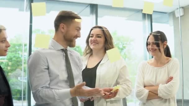 Young Corporation Employees Discussing Business Plan Stickers Office — Stock Video
