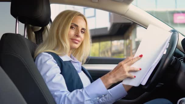 Portrait Confident Senior Woman Sitting Car Documents Business Suit Modern — Stock Video